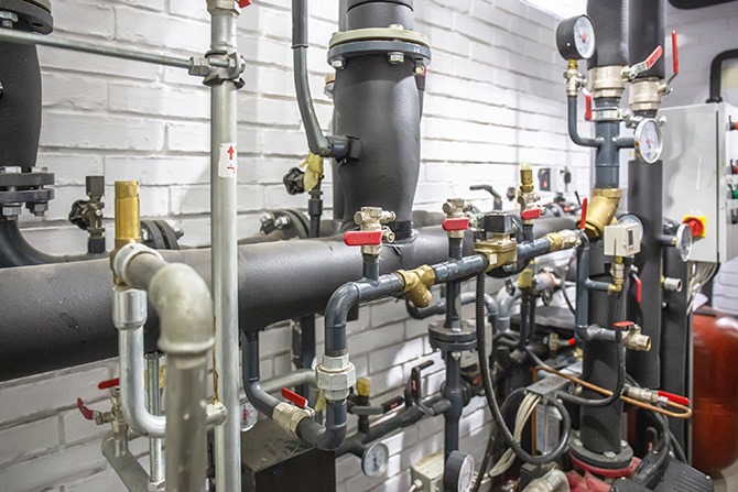 Heating system with many steel pipes, manometers and metal tubes and automated control equipment Design and Retrofitting